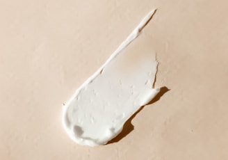 white cotton buds on white surface